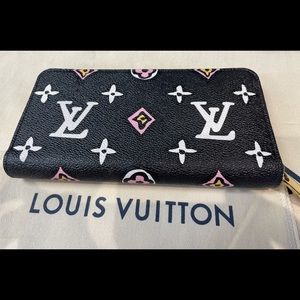 Louis Vuitton large zip around wallet. Never used.